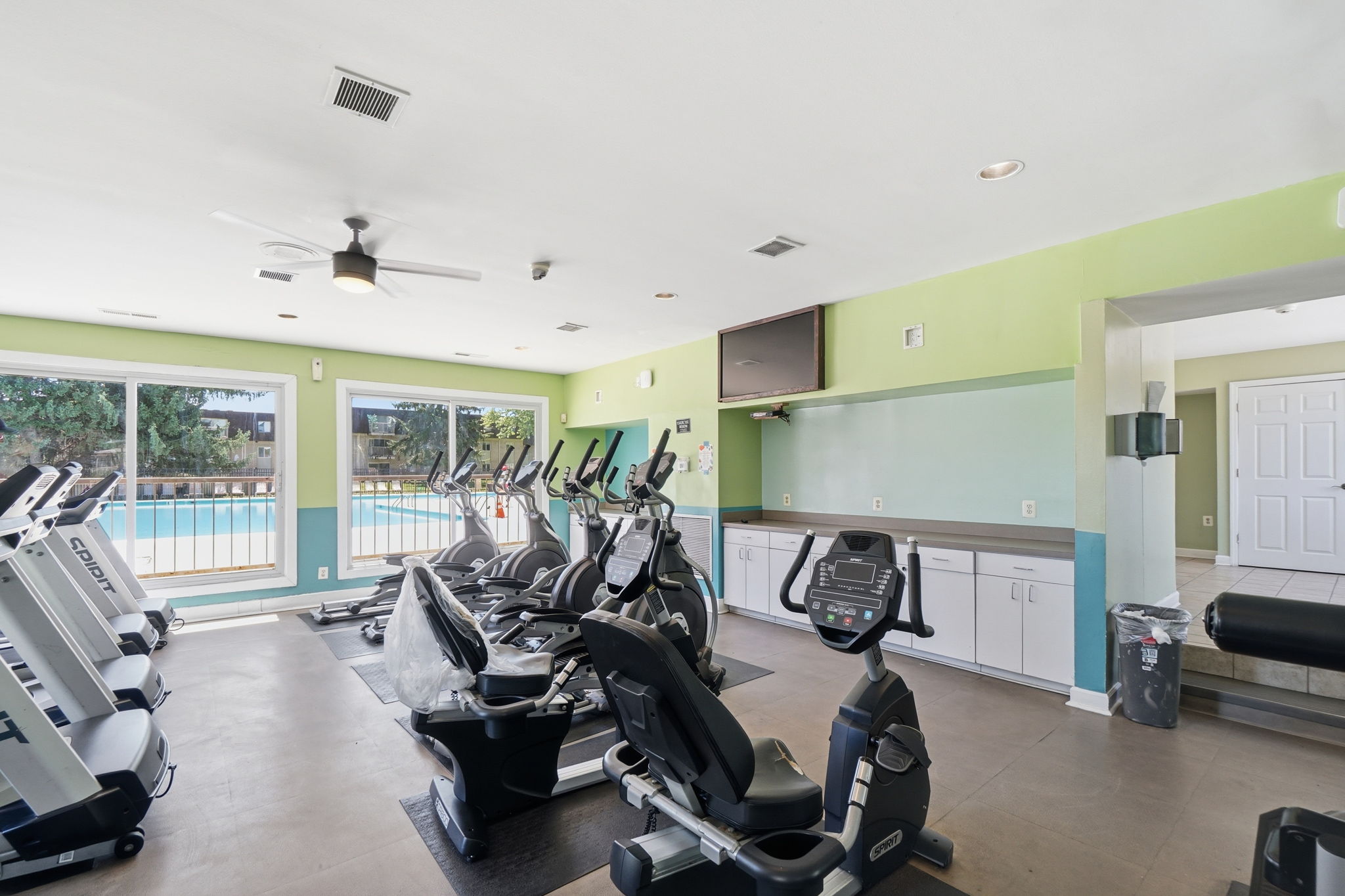 A gym with treadmills and exercise equipment.